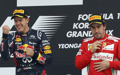 Fernando Alonso junto a Sebastian Vettel en el podio del GP de Corea.