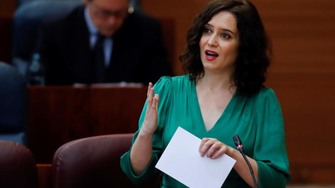 La presidenta regional, Isabel Díaz Ayuso, durante su intervención en el pleno de la Asamblea que reanuda este viernes en una de la sesión reducida la sesión telemática del jueves, suspendida por problemas técnicos. EFE/Chema Moya POOL