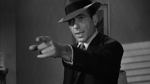 Philip Marlowe interpretado por Humphrey Bogart.