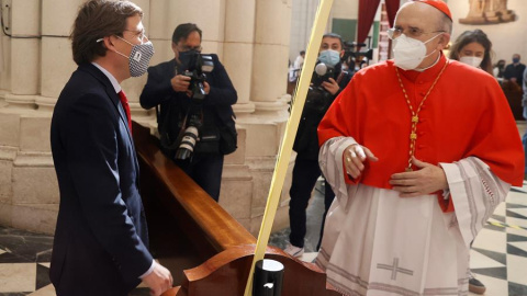 El alcalde de Madrid, José Luis Martínez-Almeida (i) conversa con el arzobispo de Madrid, cardenal Carlos Osoro (d) antes de la eucaristía del Domingo de Ramos y bendición de las palmas oficiada en la Catedral de la Almudena en Madrid este domingo.