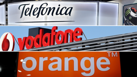 Los logos de las principales empresas de telecomunicaciones que operan en España: Telefónica, Vodafone y Orange. REUTERS/AFP