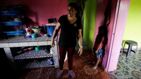 María Bonilla, mujer productora de café en Honduras. Sus cuatro hijos que han migrado a EEUU.