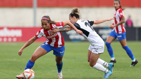 Deyna Castellanos of Atletico de Madrid and Esther Martin of Valencia in action during the spanish women league, Primera Iberdrola, football match played between Atletico de Madrid and Valencia CF at Centro Deportivo Wanda on march 26, 2022, in Alcala de