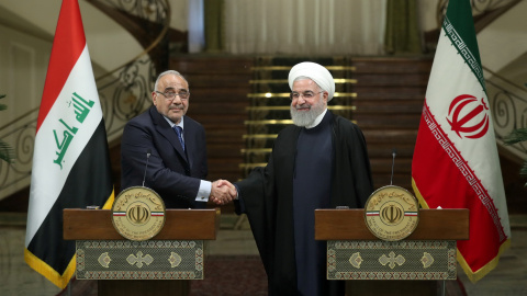 Iranian President Hassan Rouhani shake hands with Iraq's Prime Minister Adel Abdul Mahdi during a news conference in Tehran