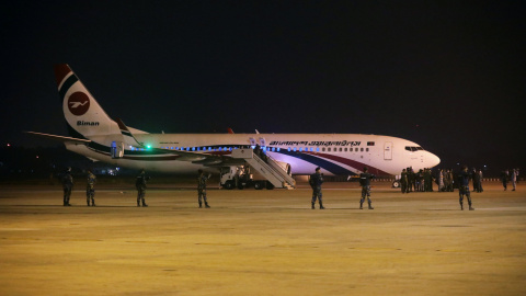 Security personnel stand guard outside of the hijacked aircraft of the Biman Bangladesh Airlines in the Shah Amanat International Airport in Chattogram, Bangladesh February 24, 2019. REUTERS/Stringer NO RESALES. NO ARCHIVES