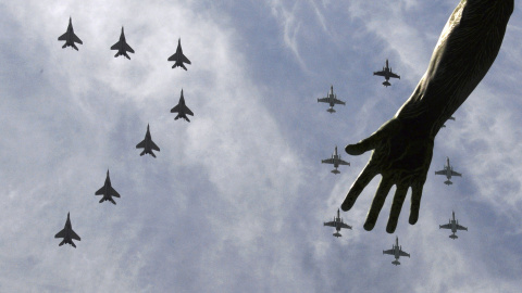 MiG-29 and Su-25 military jets fly in formation above Red Square during the Victory Day parade in Moscow. REUTERS/Host Photo Agency/RIA Novosti