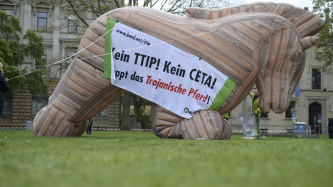 Protesters set up an inflatable 'Trojan Horse' as they demonstrate against TTIP and CETA trade agreements ahead of U.S. President Barack Obama's visit in Hannover