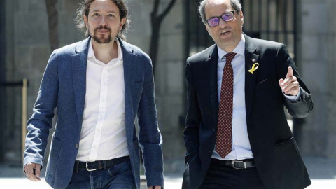 El presidente catalán, Quim Torra, y el secretario general de Podemos, Pablo Iglesias, se han visto en Barcelona. (ANDREU DALMAU | EFE)