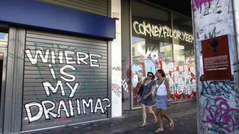 "¿Dónde están mis drahmas?" Otra pintada en el centro de Atenas. - REUTERS