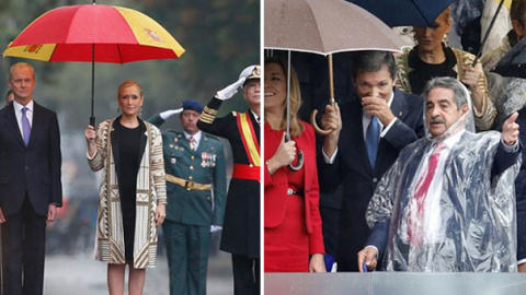 Cifuentes y Revilla se resguardan de la lluvia durante el desfile.- EFE