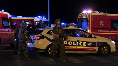 French soldiers and rescue forces are seen at the scene whare at least 30 people were killed in Nice, France, when a truck ran into a crowd celebrating the Bastille Day national holiday July 14, 2016. REUTERS/Eric Gaillard