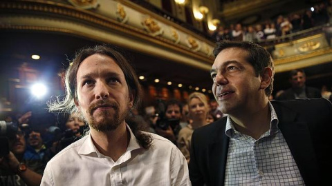 Pablo Iglesias y Alexis Tsipras, en un acto de Podemos en Madrid, en 2014.- REUTERS