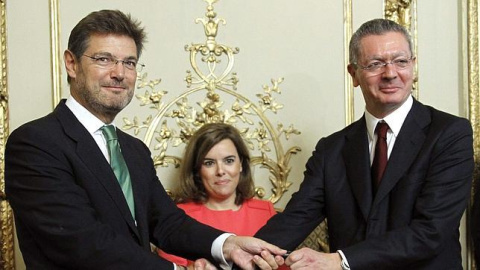 Rafael Catalá, minsitro de Jusiticia, junto a Gallardón. EFE