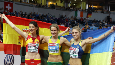 Beitia Ruth of Spain (L), Lithuania's Airine Palsyte and Ukraine's Yuliya Levchenko (R) pose with their national flags after competing in the Women's High Jump final at the European Athletics Indoor Championships in Belgrade, Serbia, 04 Mar