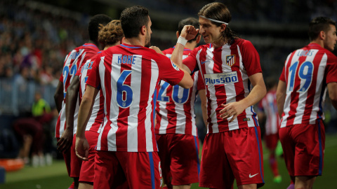 Koke y Filipe Luis celebran la victoria ante el Málaga.- REUTERS