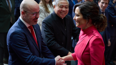 La presidenta de la Comunidad de Madrid, Isabel Díaz Ayuso saluda al delegado del Gobierno en la Comunidad de Madrid, Francisco Martín, a su llegada a los actos conmemorativos del 45º aniversario de la Constitución Española, en la Real Casa