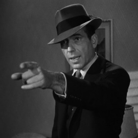 Philip Marlowe interpretado por Humphrey Bogart.