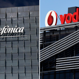 Los logos de Telefónica y de Vodafone, en sus sedes en la zona norte de Madrid. REUTERS/AFP