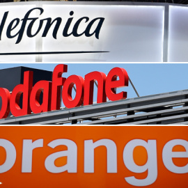 Los logos de las principales empresas de telecomunicaciones que operan en España: Telefónica, Vodafone y Orange. REUTERS/AFP