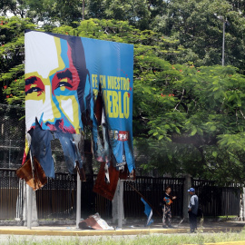 31 de julio de 2024. Valla publicitaria de Nicolás Madura quemada por las protestas contra los resultados electorales en Venezuela, el 31 de julio de 2024.