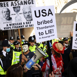 Supporters of Wikileaks founder Julian Assange protest outside the Royal Courts of Justice in London, Britain, October 27, 2021. REUTERS/Henry Nicholls