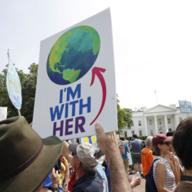 Participants walk along Pennsylvania Ave., infront of the White House in Washington, during a demonstration and march,Saturday, April 29, 2017. Thousands of people gather across the country to march in protest of President Donald Trump's environmental pol