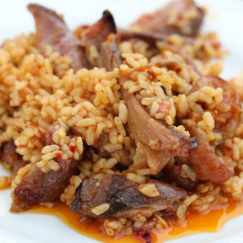 Arroz con pato confitado.